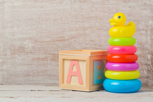 Baby toys on wooden table. Child development concept