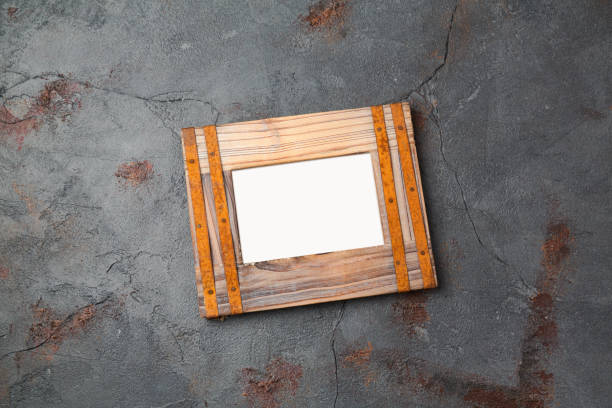 istock Rustic vintage photo frame over dark background. View from above 846055380