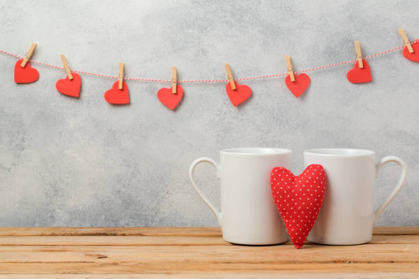 istock Valentines day concept with white coffee cups and heart shape over rustic background 846055422