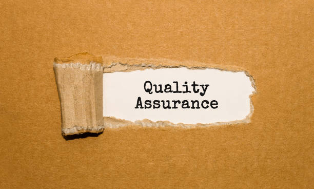 istock The text Quality Assurance appearing behind torn brown paper 846055742