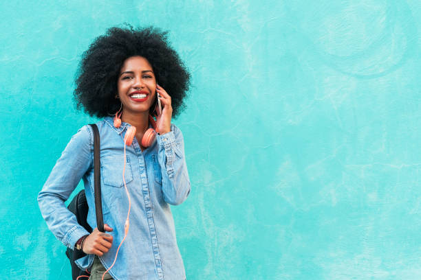 istock Beautiful afro american woman using her mobile. 846055874