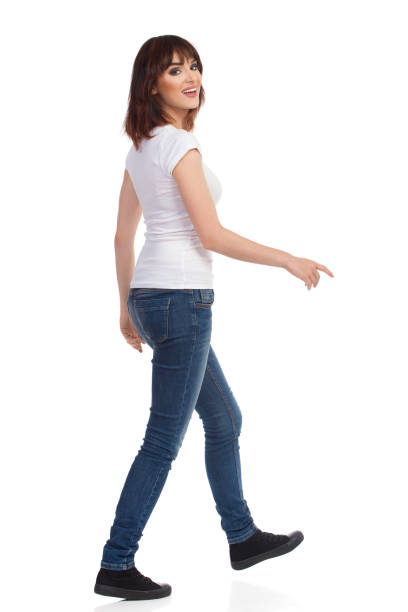 istock Young Woman Is Walking And Looking At Camera Over The Shoulder 846058232