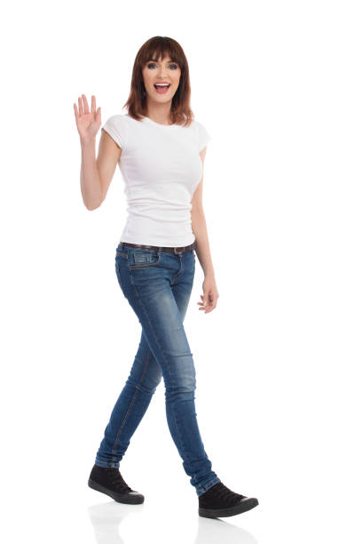 istock Young Woman Is Walking, Talking And Waving Hand 846058238