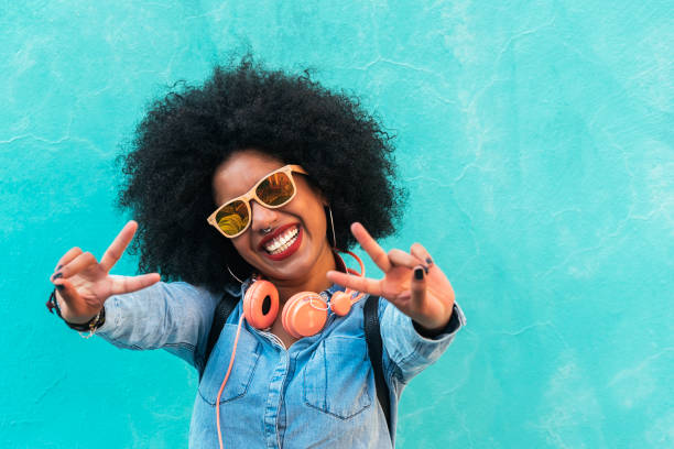 Beautiful afro american woman making peace sign.