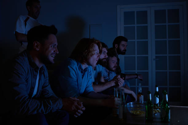 istock Night watching TV with friends 846062454