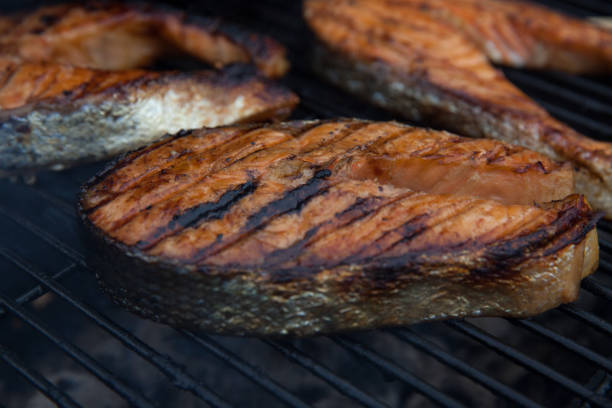 istock Salmon red fish steaks on the flaming grill 846067574