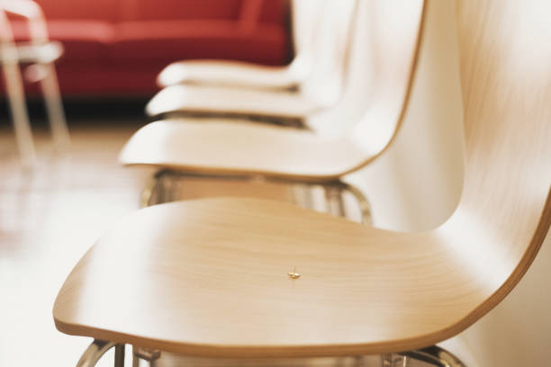 Rows of chairs with empty frame on the wall, object background