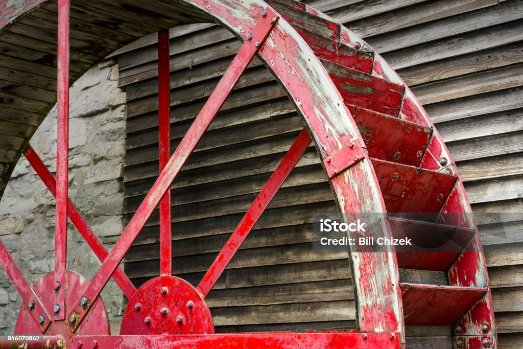 Mill Wheel 2 The idle water wheel on the side of a Wisconsin mill. Building Exterior Stock Photo