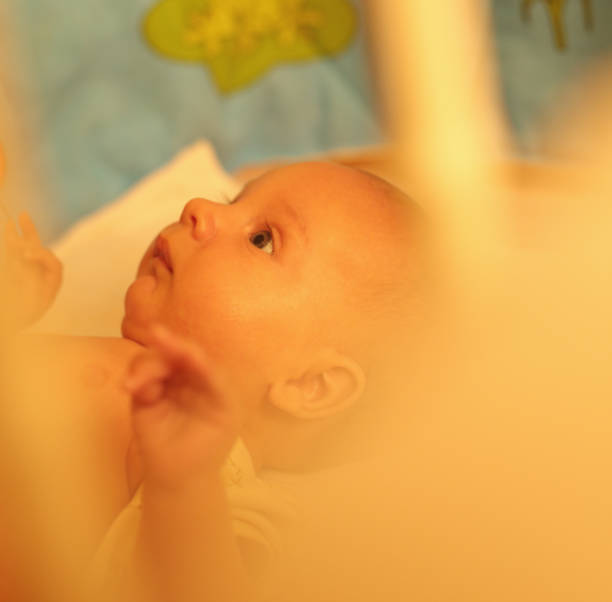 istock Little baby laying on a bed 846074334