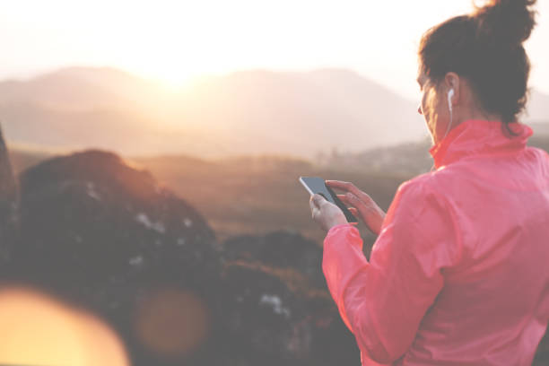 istock Woman athlete with mobile phone preparing for workout 846074796