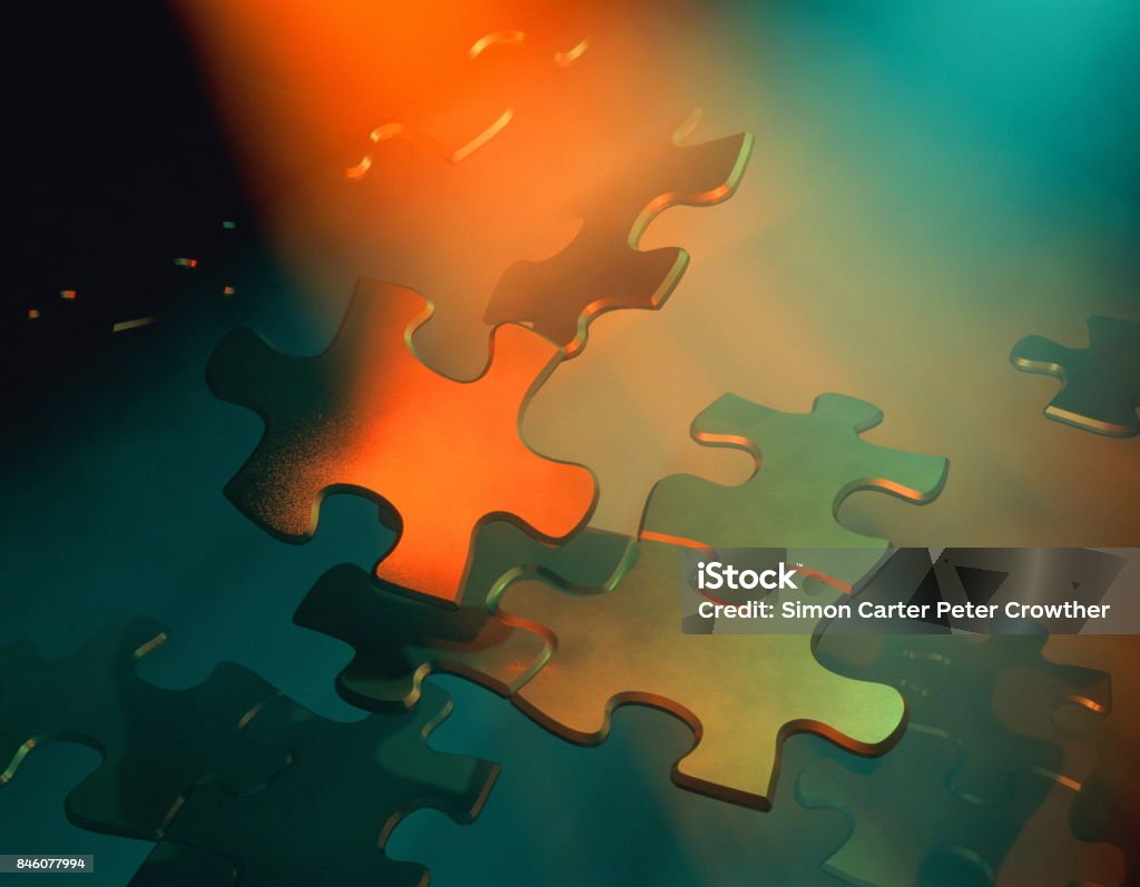 Jigsaw pieces floating. Mergers and Acquisitions Stock Photo