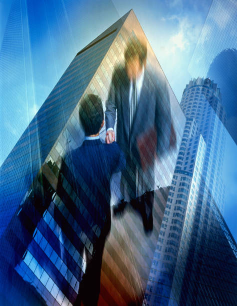 istock High-rise buildings and businessmen shaking hands. 846078012