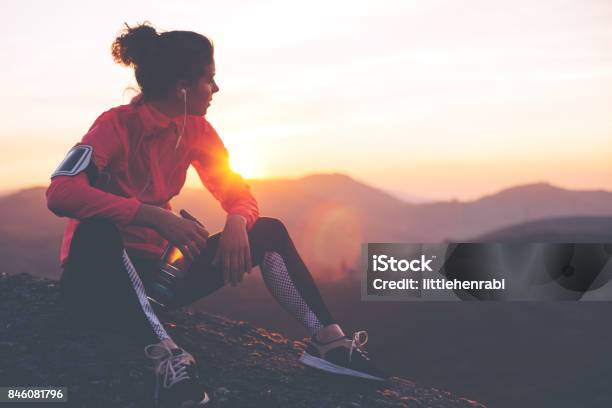 Fit Woman Athlete Resting Outdoors Stock Photo - Download Image Now - Running, Women, Exercising