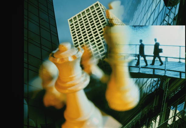 Chess King and Queen over business montage.