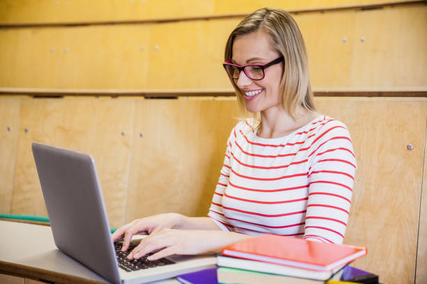 istock Happy female student typing on laptop 846082280