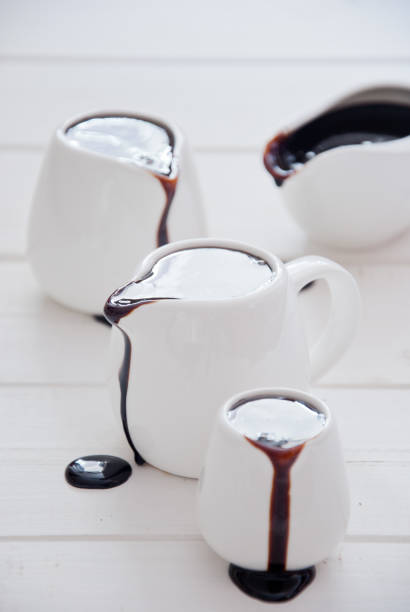 istock Dark chocolate sauce in white sauceboats 846086888