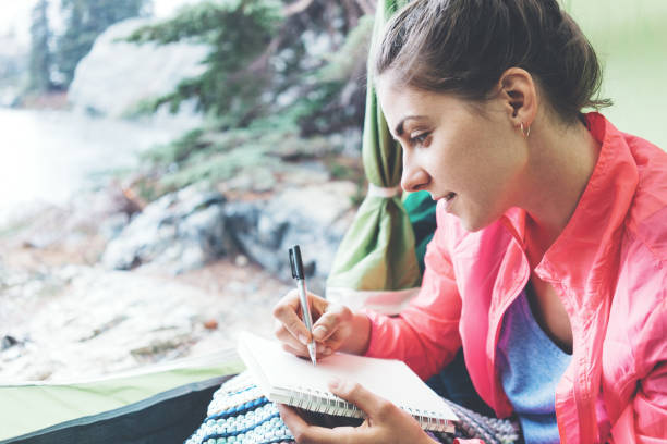 istock Woman sitting in tent with dairy 846087700