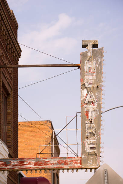 istock Old Vertical composition metal neon theater sign against blue sky 846088144