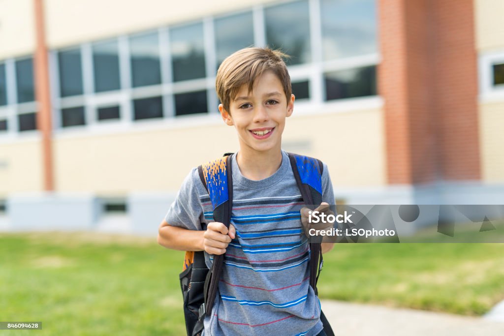 Great Portrait Of School Pupil Outside Classroom Carrying Bags The Great Portrait Of School Pupil Outside Classroom Carrying Bags Boys Stock Photo