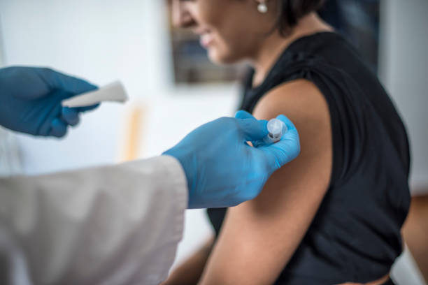 istock Doctor performs vaccination on a young girl 846101904