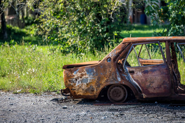 istock Ruined Car on Countryside Road 846109362