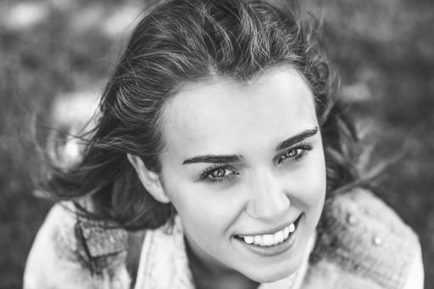 istock Pretty cheerful student looking at camera in black and white 846110076