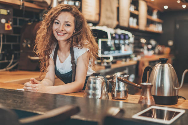 istock Beautiful barista at the bar counter 846116326