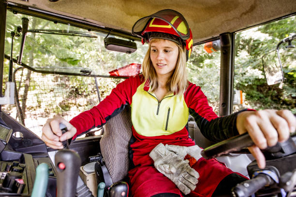 istock Young Lumberjack Woman Driving a Tractor 846117910