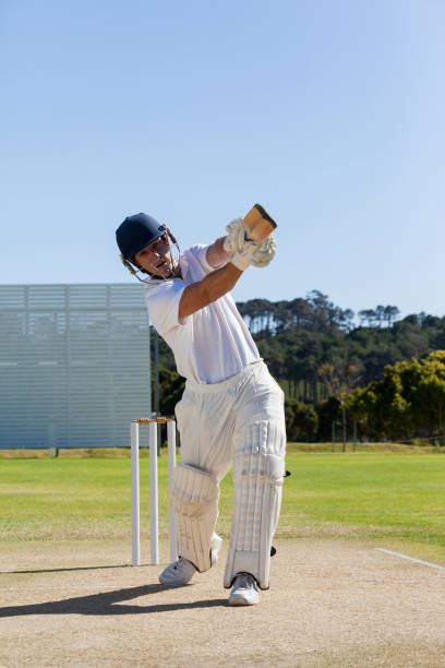 istock Cricket player batting on field against sky 846124082
