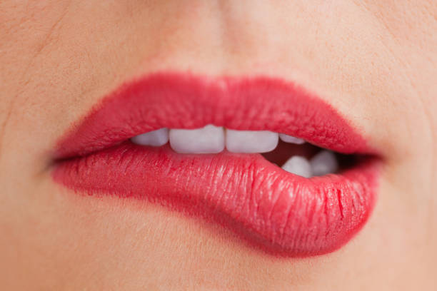 istock Attractive woman biting her beautiful lips 846134962