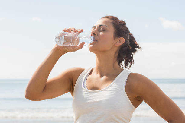 istock Content beautiful woman drinking of water bottle 846138212