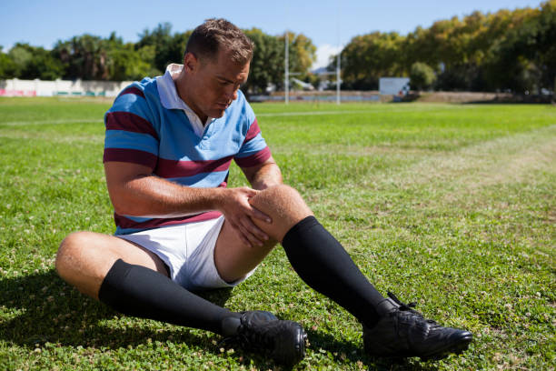 istock Full length of rugby player sitting on playing field 846145014