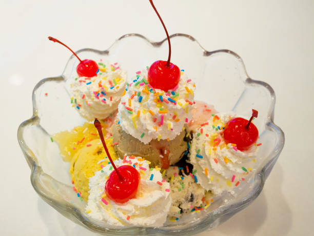 istock Ice cream scoops with whipped cream and cherry 846158270