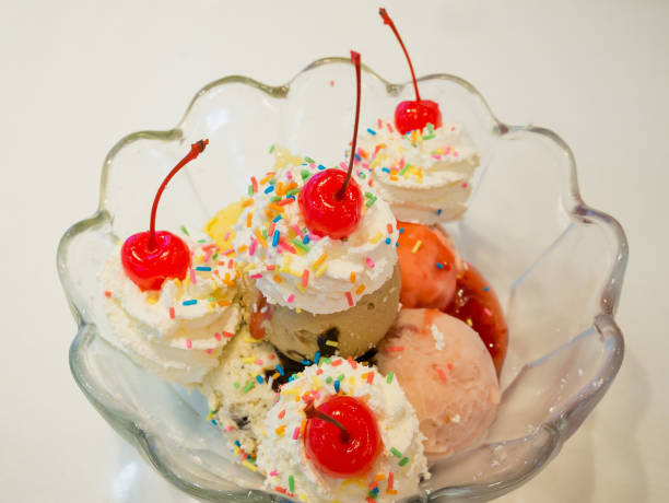 istock Ice cream scoops with whipped cream and cherry 846158274