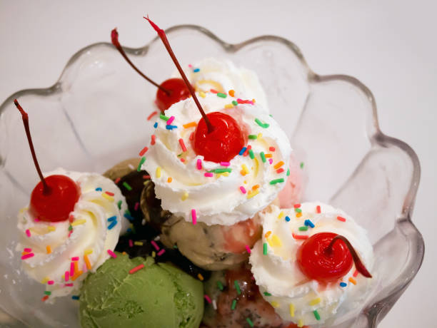 istock Ice cream scoops with cherry and whipped cream 846158276