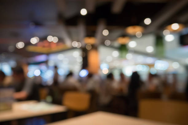 istock People in restaurant cafe interior with bokeh light blurred customer abstract background 846158386