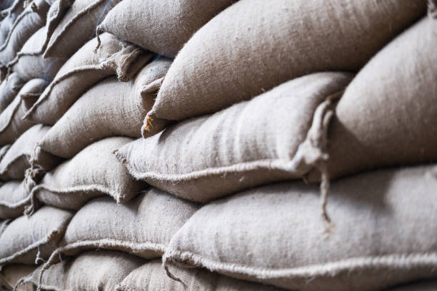 istock hemp sacks containing coffee bean in warehouse. stacked sacks in storehouse. 846158590
