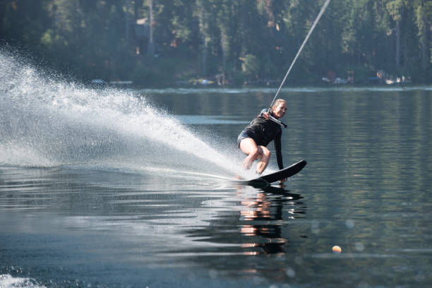 istock Beautiful woman waterskiing 846158678