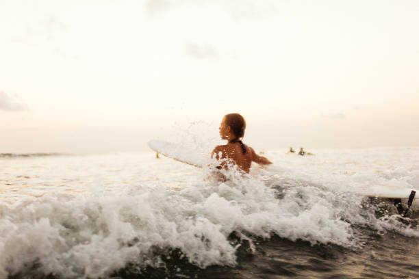 istock young surfer woman 846158768