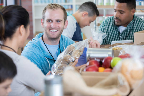 istock Friendly food bank volunteer accepts donations 846168842