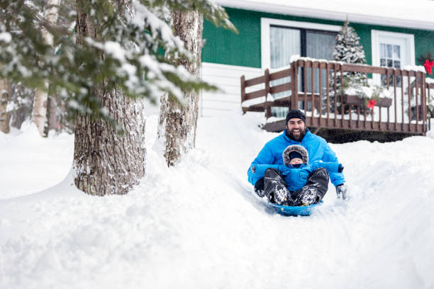 istock Father and Son Sledding on Snow at Christmas 846175144