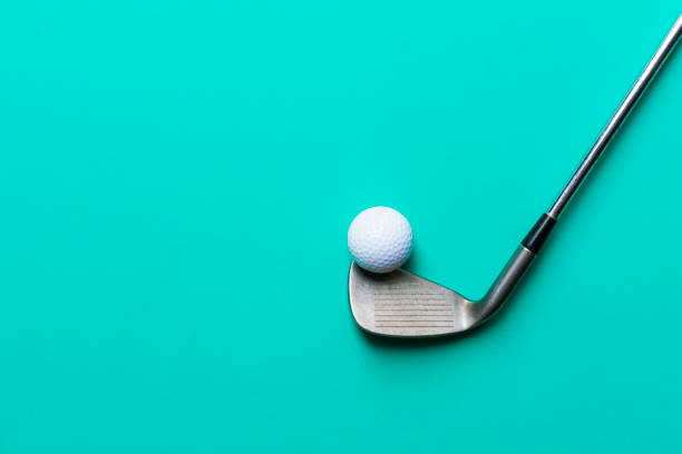 istock golf ball and golf club on green background 846185870