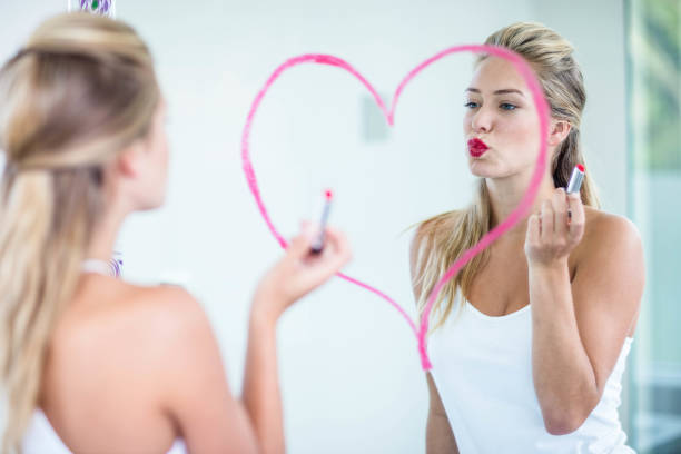 istock Woman applying lipstick 846189188