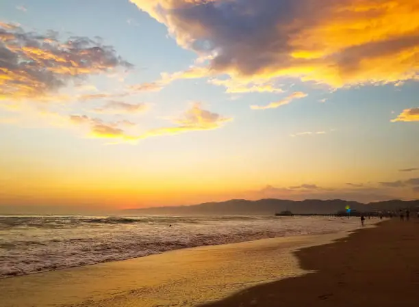 a view of Santa Monica beach at sunset