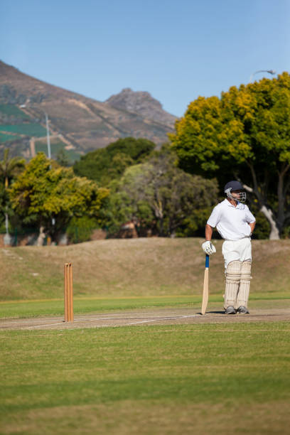 istock Full length of batsman standing on field during match 846193504