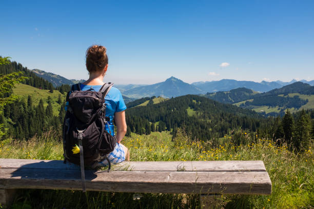 female hiker enjoying view in the german Alps, Allgau