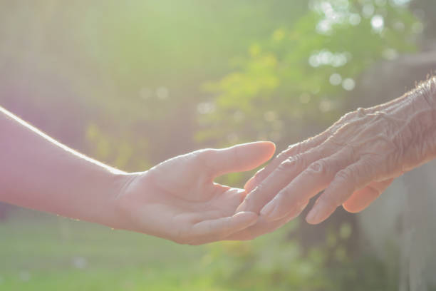istock Hand,old and  hand with light of the morning 846205422