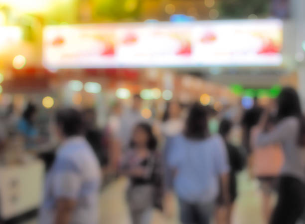 istock Blurred people walking on city street. 846211282