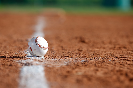 Baseball on the Chalk Line of the Infield