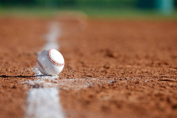 Baseball in the Infield Baseball on the Chalk Line of the Infield sports chalk stock pictures, royalty-free photos & images